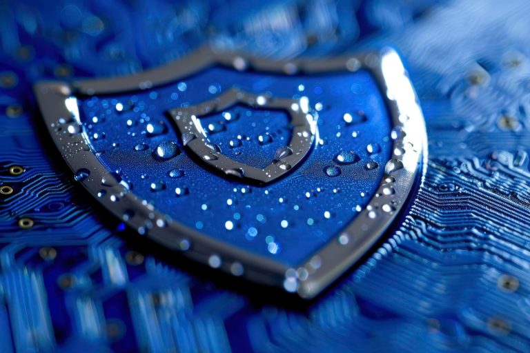 Glossy blue security shield with water drops on blue circuit board representing AI regulation and compliance