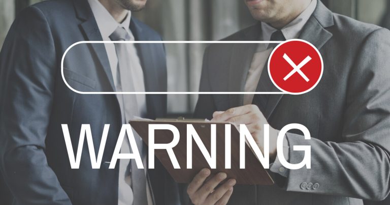 Warning and red X over a search bar — Google spam policy enforcement
