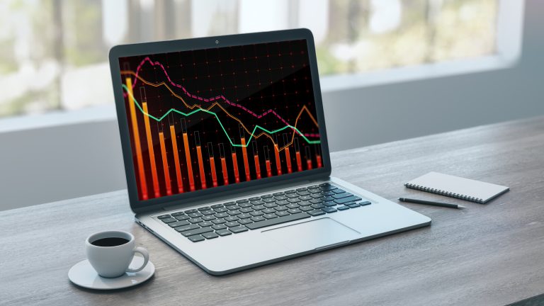Laptop on a desk showing a declining chart, illustrating the Search Console Generative AI report impressions drop